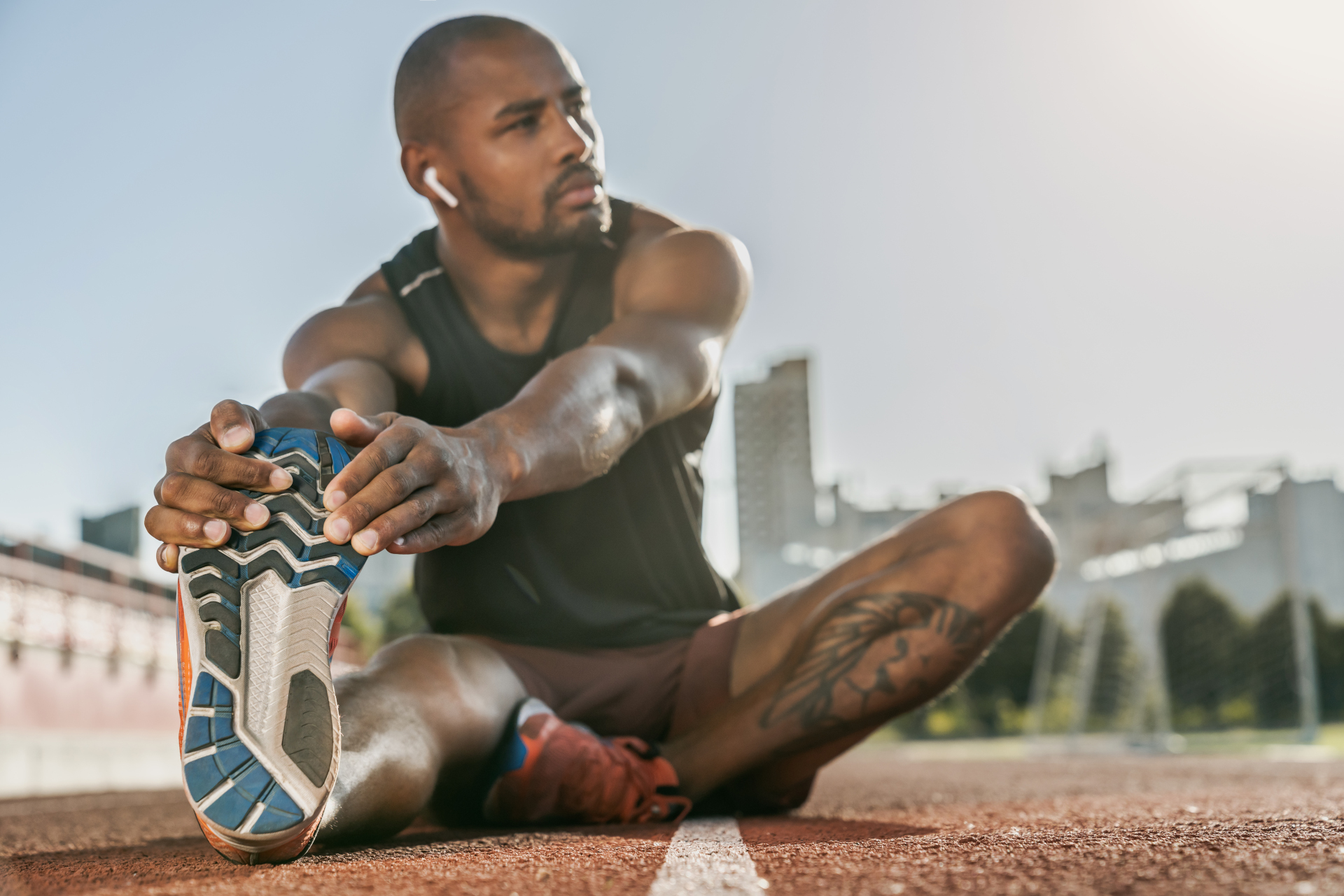 runner stretching before race