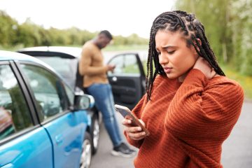 Driver making phone call after vehicle accident