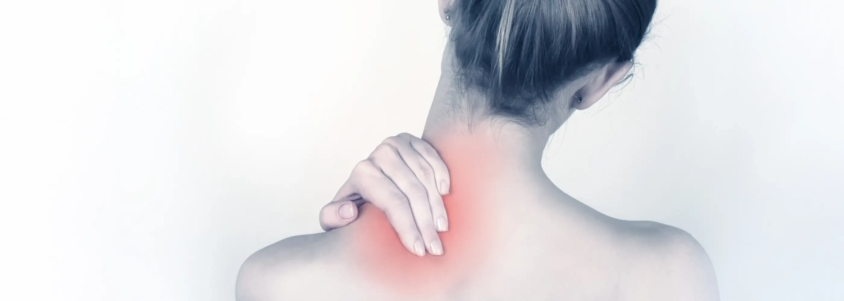 Person rubbing their sore neck at Pro Health & Rehab Chiropractic in Marietta, GA