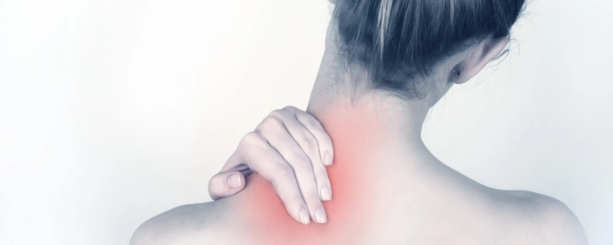Person rubbing their sore neck at Pro Health & Rehab Chiropractic in Marietta, GA
